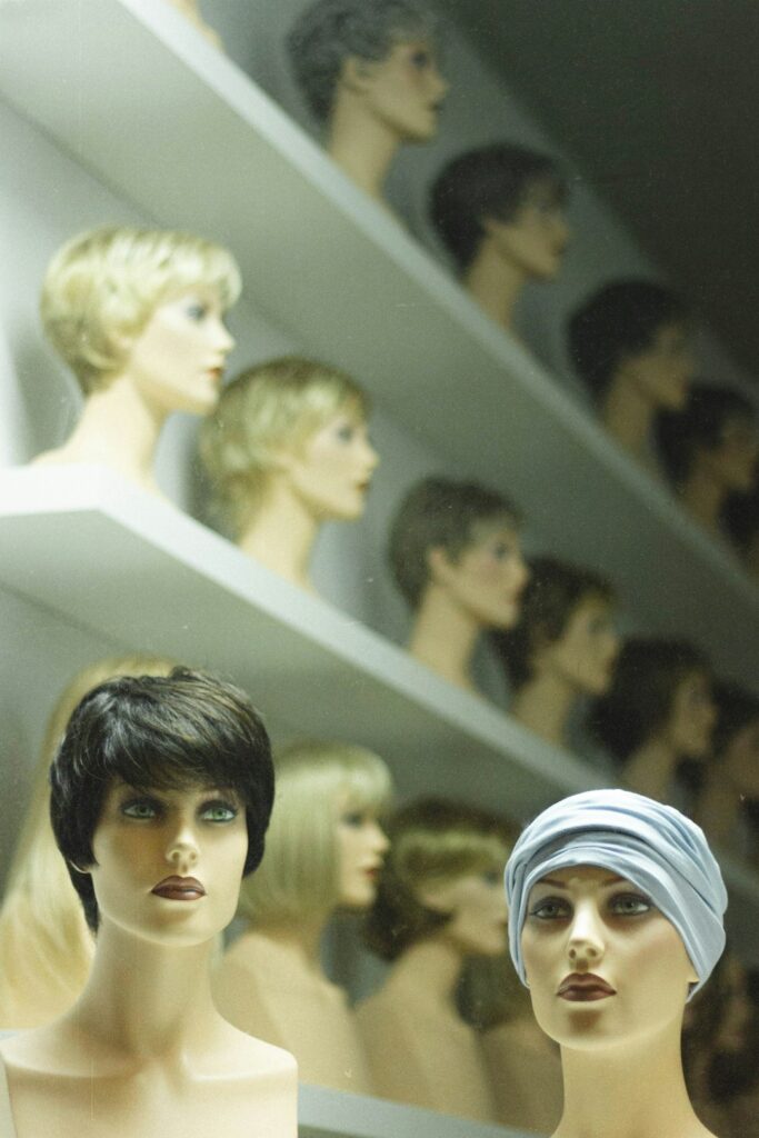 Puppet heads wearing wigs